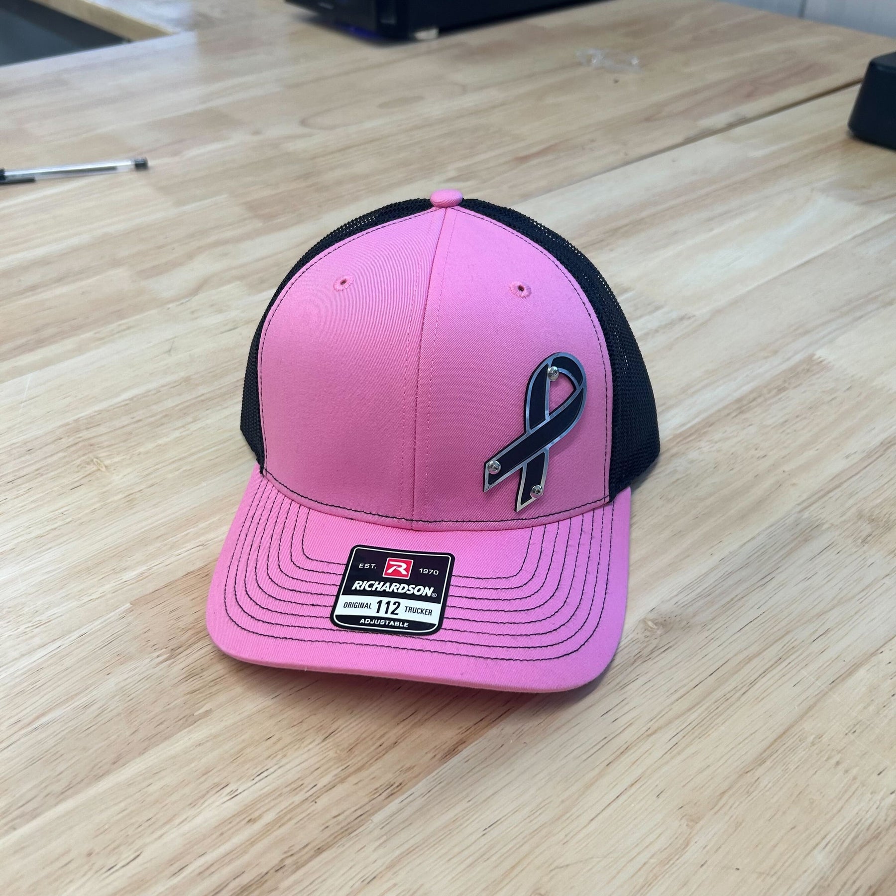 Breast Cancer Awareness Badge Hat - Black and Brushed Stainless Badge